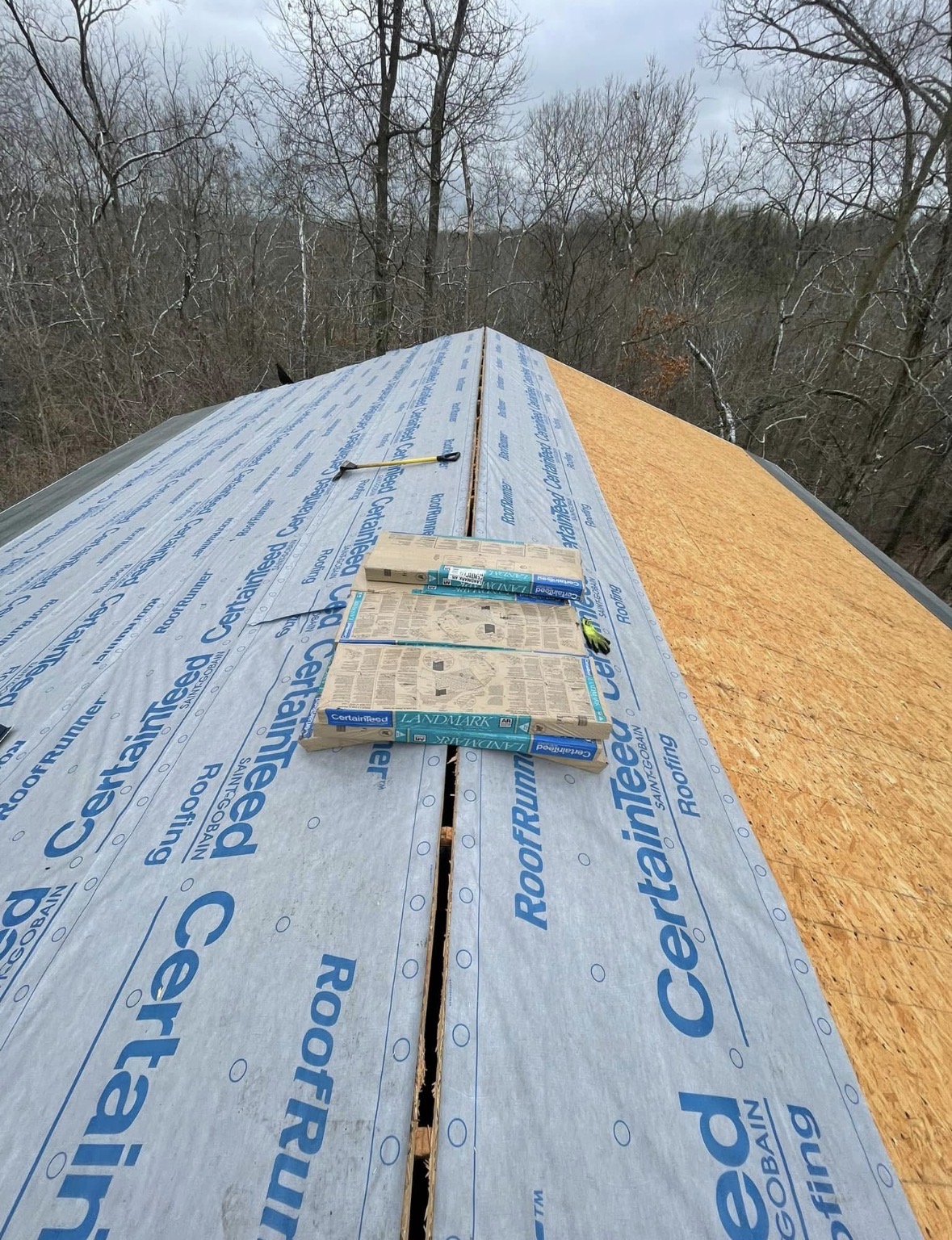 CertainTeed underlayment and bare decking part-way up the roof